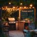 Backyard outdoor kitchen with modern grill and cozy lighting – save this warm and inviting patio kitchen idea for your next summer upgrade!
